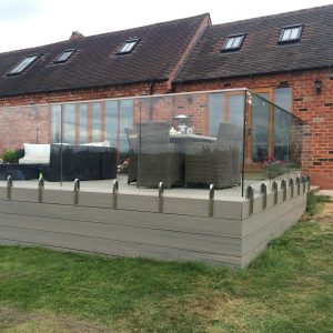 Frameless mini-post glass balustrade and RESORTDECK decking area with seating