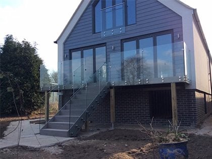 glass and stainless steel balustrade at a house